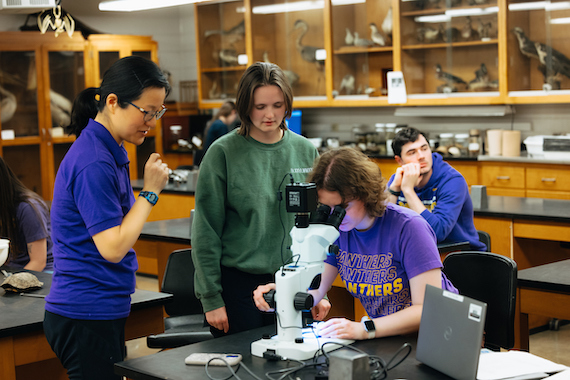 Students and faculty member in a lab