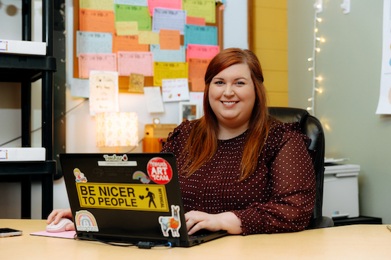 Student in front of a computer in a classroom
