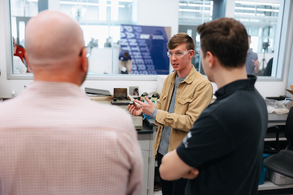 Student showing people around the engineering building