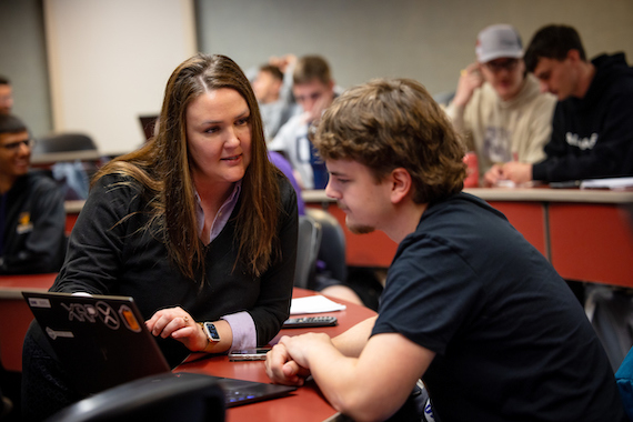 Student being helped by a business professor