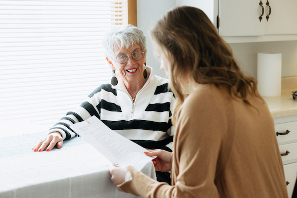 Student working with an individual in UNI's dementia house