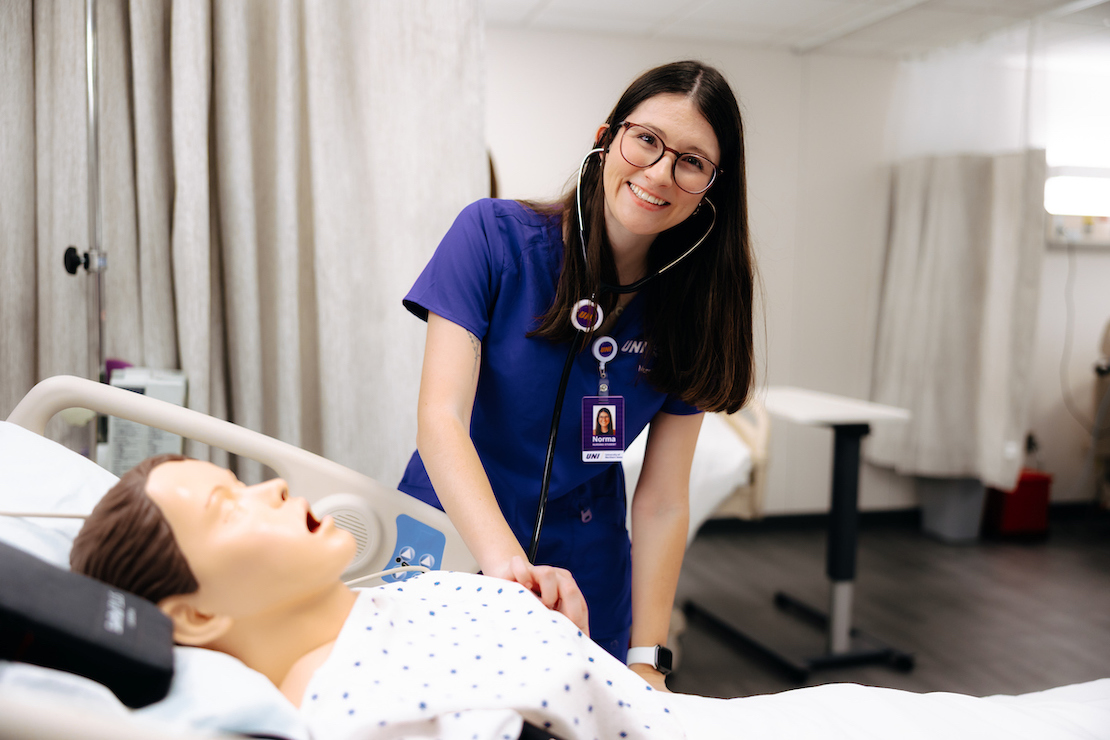 Nursing student working on a dummy