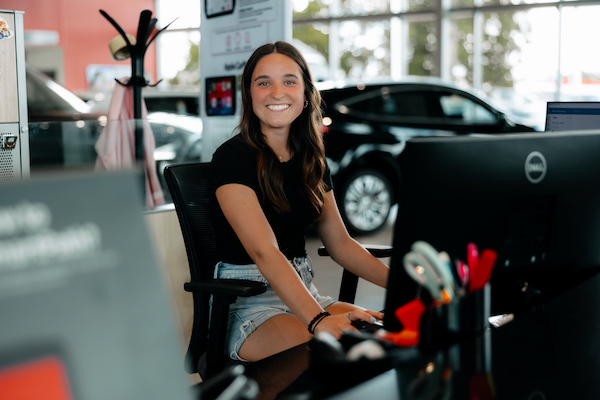 Student sitting at a desk at her internship