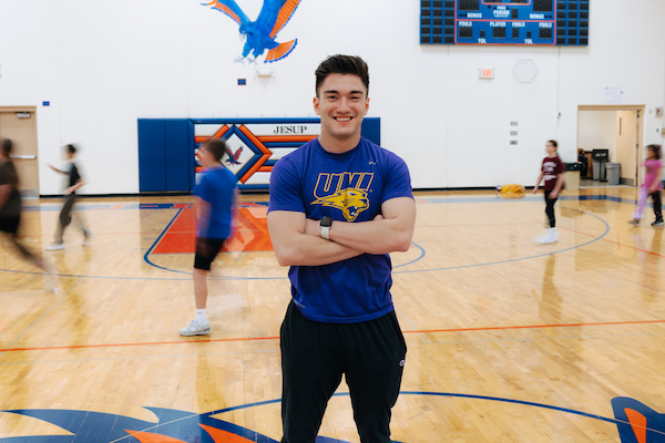 Physical education student teacher in a gym