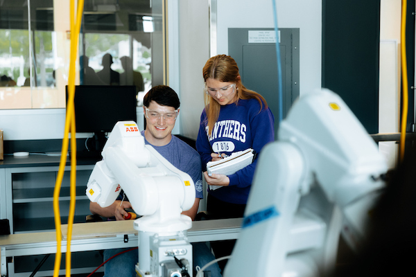 Students testing a project in an engineering lab