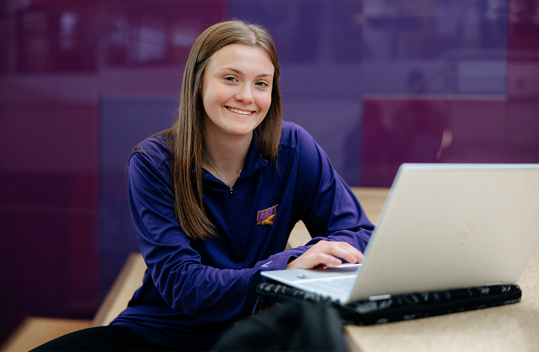 student studying on a laptop