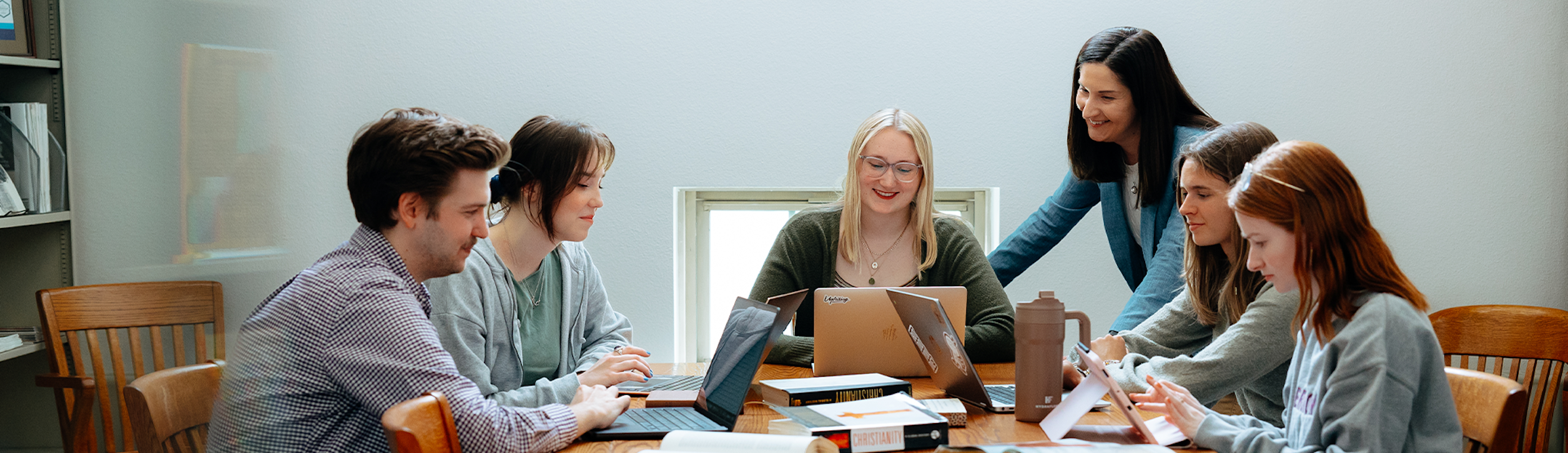 Students and an instructor in a group learning scenario.