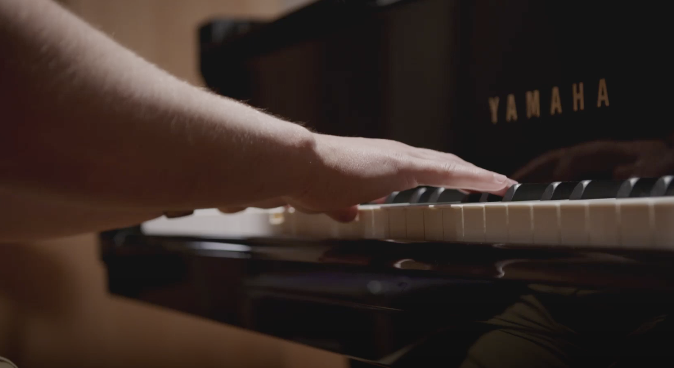 uni music student hands at piano